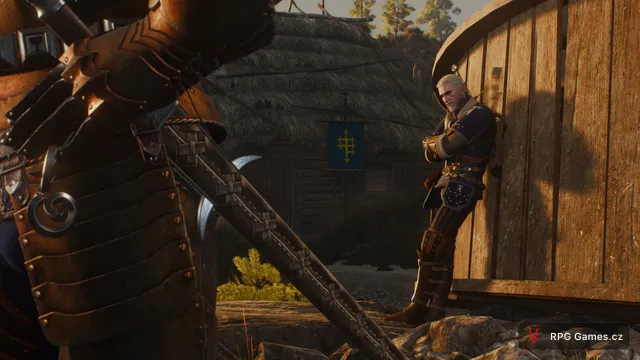 Geralt opřený o chalupu při dialogu ve Velenu v Zaklínači 3