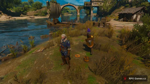 Geralt u řeky s kamenným mostem a lodí v Toussaintu v Remasteru